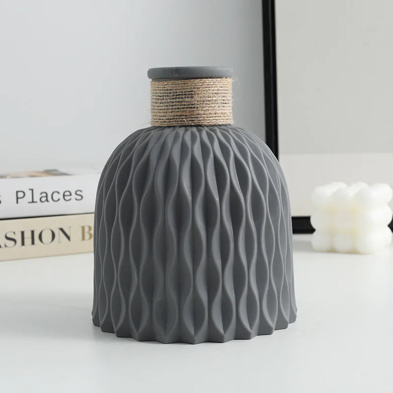 Gray textured vase with wavy pattern on a light background