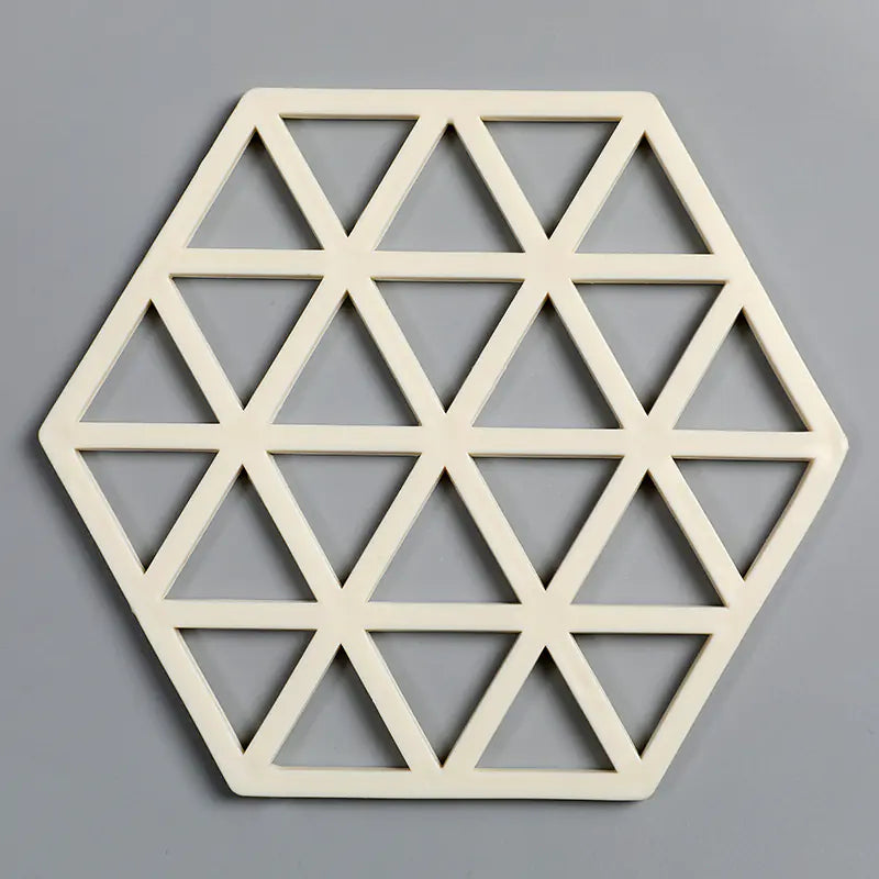 Geometric hexagonal wall art with a white frame on a gray background