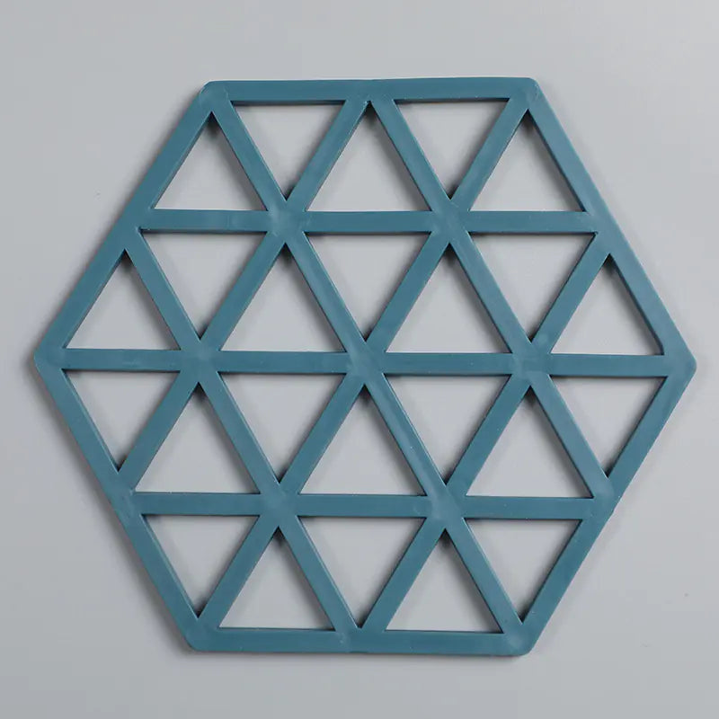 Blue geometric hexagonal wall art on a gray background