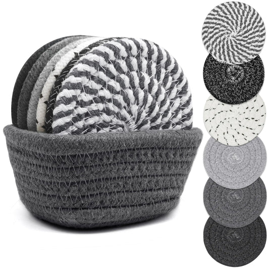 Set of gray and black coasters with a woven coaster holder on a white background.