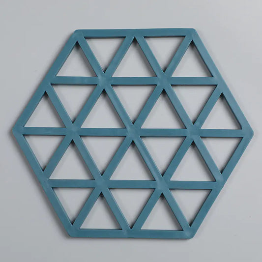 Blue geometric hexagonal wall art on a gray background